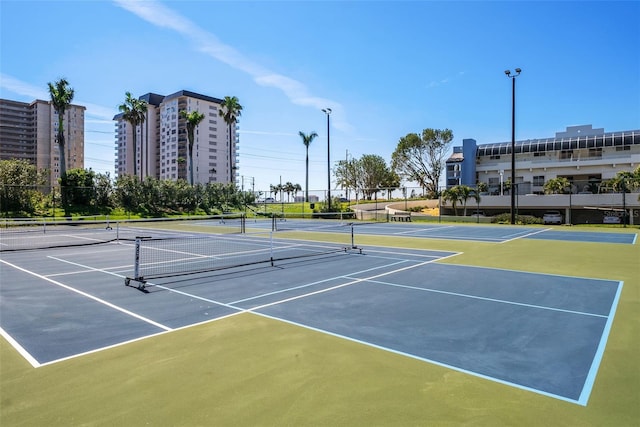 view of sport court with community basketball court and fence