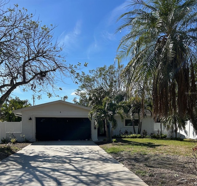 view of front facade with a garage and a front lawn