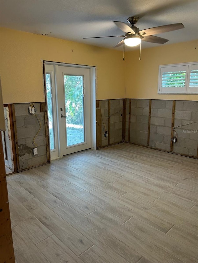 interior space with light hardwood / wood-style floors and ceiling fan