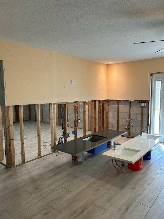 miscellaneous room featuring a textured ceiling