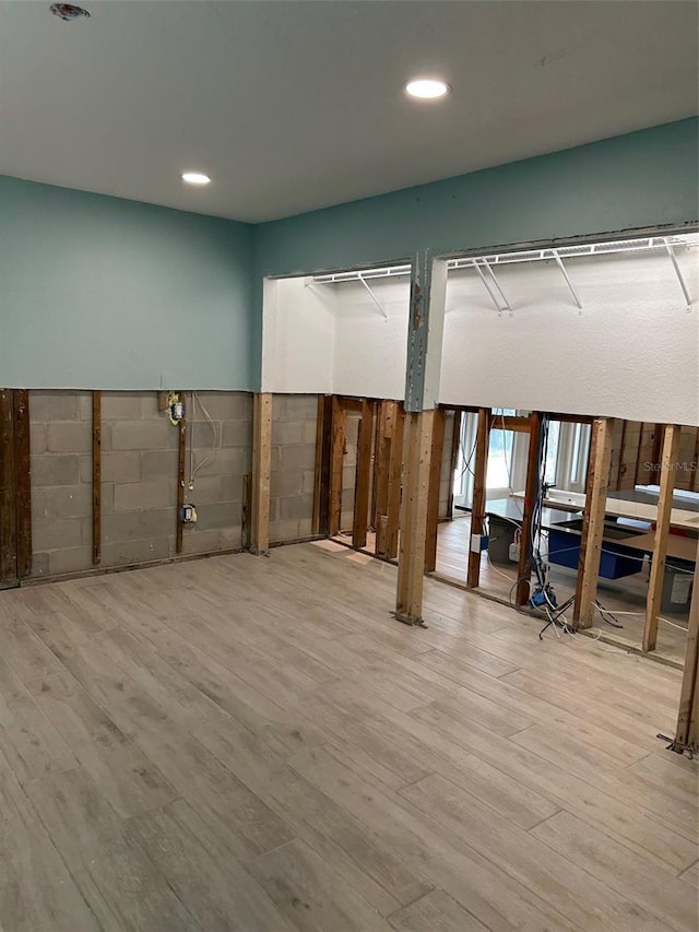 basement featuring hardwood / wood-style floors