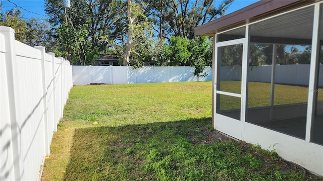 view of yard with a sunroom