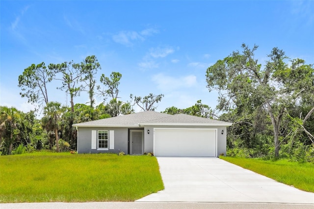 view of front of home with a garage and a front yard