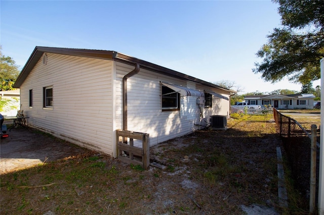 view of side of property featuring cooling unit