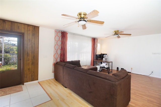 living room featuring ceiling fan and light hardwood / wood-style flooring