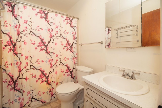 bathroom featuring tile patterned floors, vanity, toilet, and curtained shower