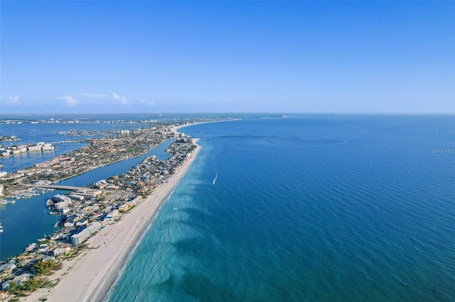 birds eye view of property featuring a beach view and a water view