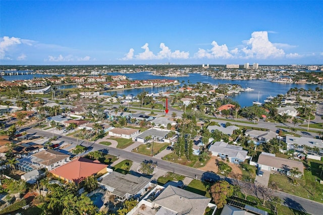 birds eye view of property with a water view and a residential view