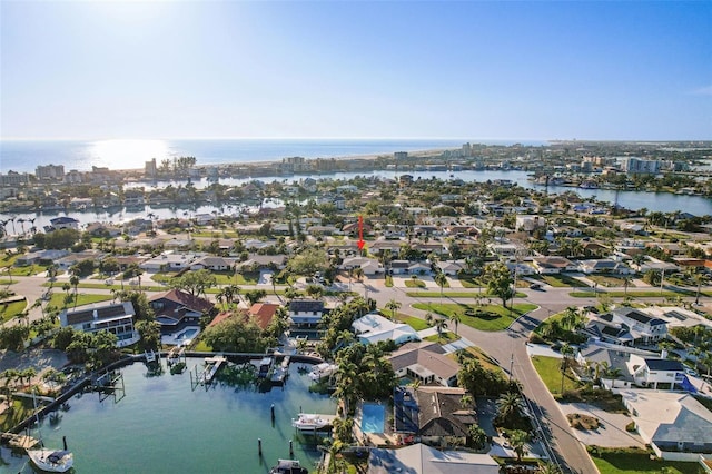 bird's eye view with a water view and a residential view