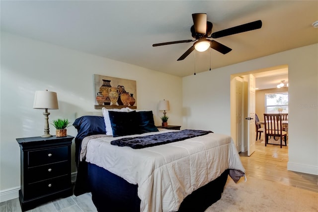 bedroom featuring ceiling fan and hardwood / wood-style floors