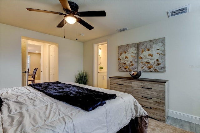 bedroom featuring connected bathroom and ceiling fan