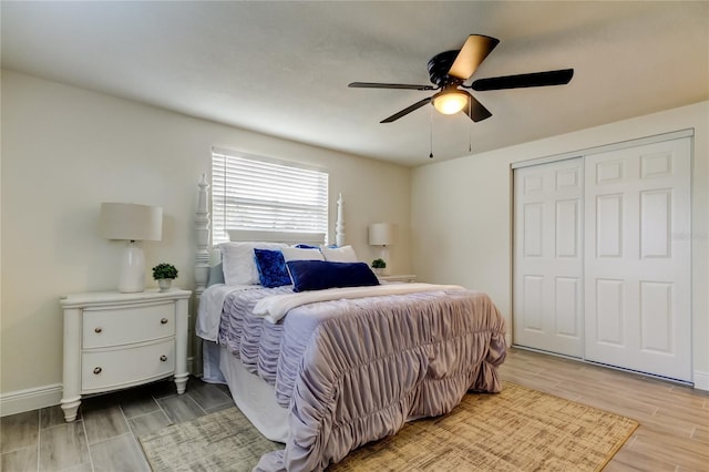 bedroom with ceiling fan and a closet