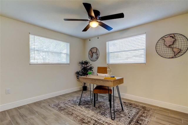 home office featuring ceiling fan and light wood-type flooring