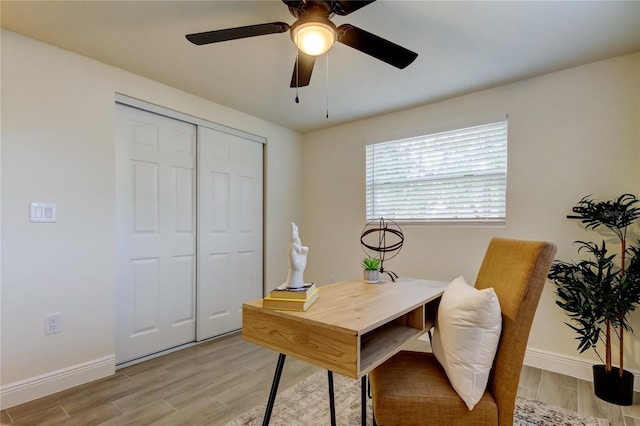 office area featuring light hardwood / wood-style floors and ceiling fan