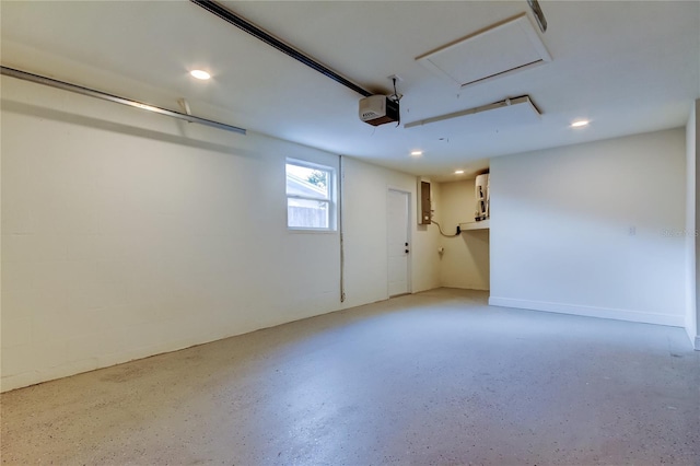 garage featuring a garage door opener and electric panel