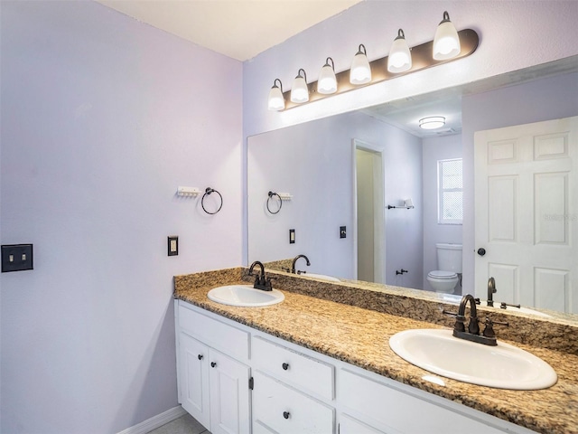 bathroom with vanity and toilet