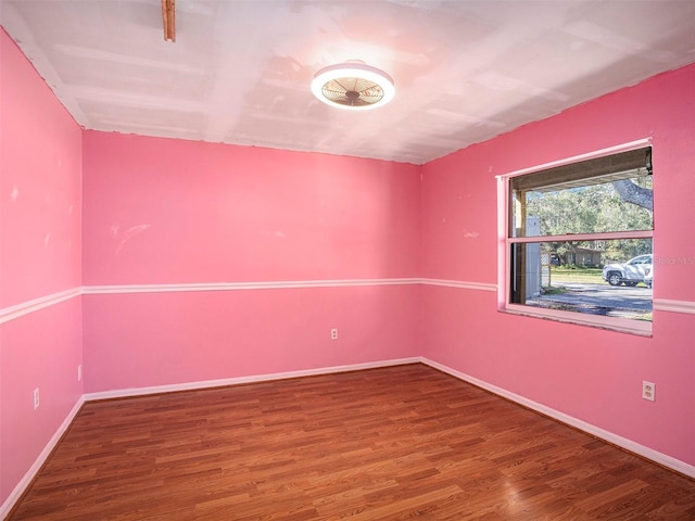 unfurnished room with hardwood / wood-style floors