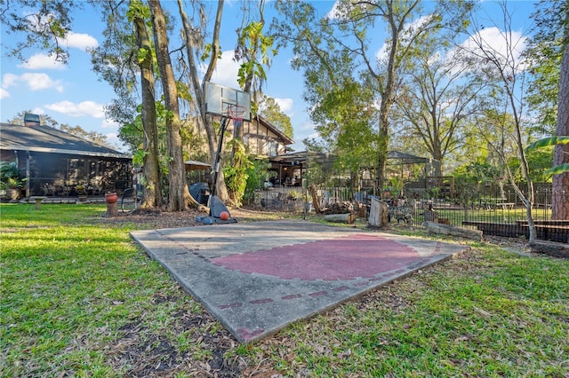 view of basketball court featuring a lawn