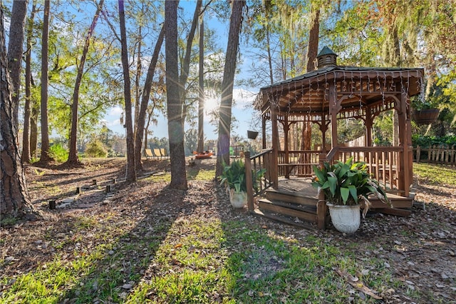 view of yard with a gazebo and a deck