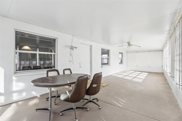 interior space with ceiling fan