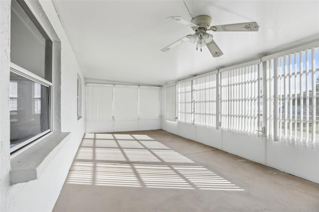 sunroom featuring ceiling fan