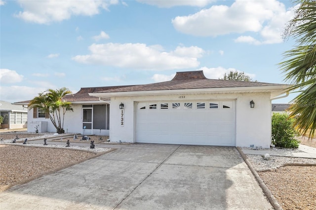 ranch-style house featuring a garage