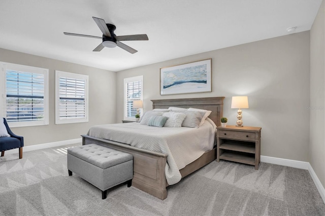 bedroom featuring ceiling fan and light colored carpet