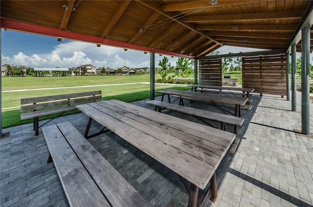 wooden deck featuring a gazebo and a yard