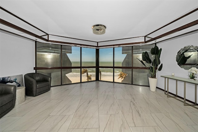 living room featuring floor to ceiling windows