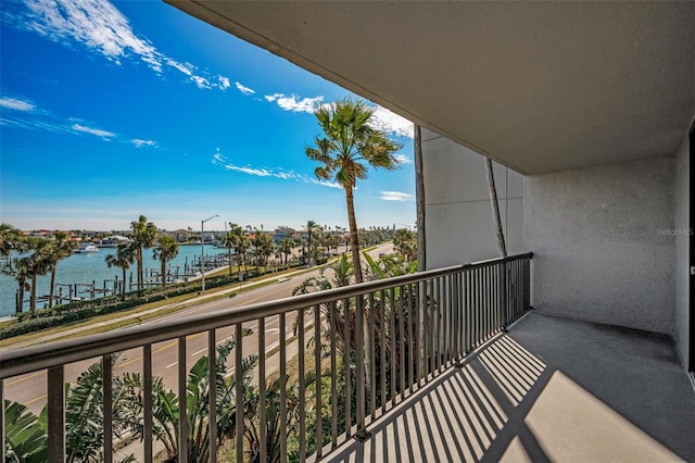 balcony featuring a water view