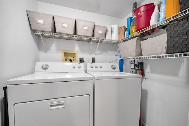 clothes washing area with washer and clothes dryer