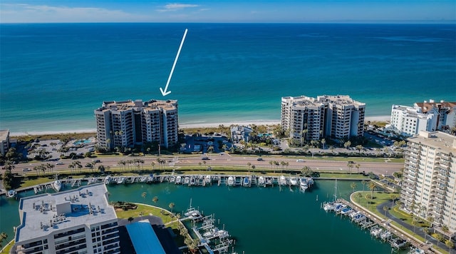 birds eye view of property featuring a view of the beach and a water view