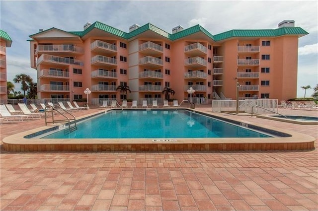 view of swimming pool featuring a patio area