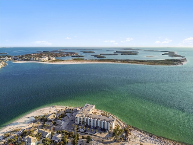 birds eye view of property featuring a water view and a beach view