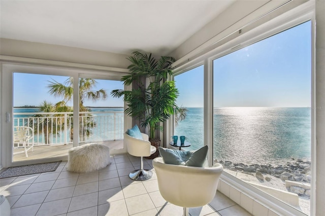 sunroom / solarium with a water view