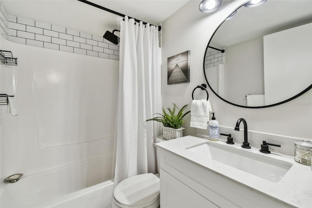 full bathroom with vanity, shower / tub combo with curtain, and toilet