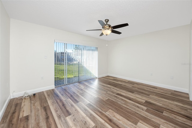 unfurnished room featuring wood-type flooring, ceiling fan, and a textured ceiling