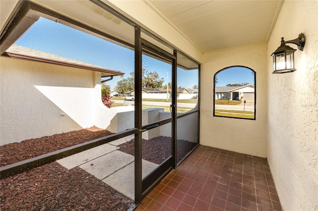 unfurnished sunroom with plenty of natural light