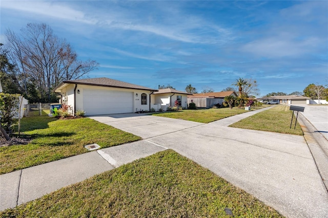 ranch-style house with a garage and a front lawn