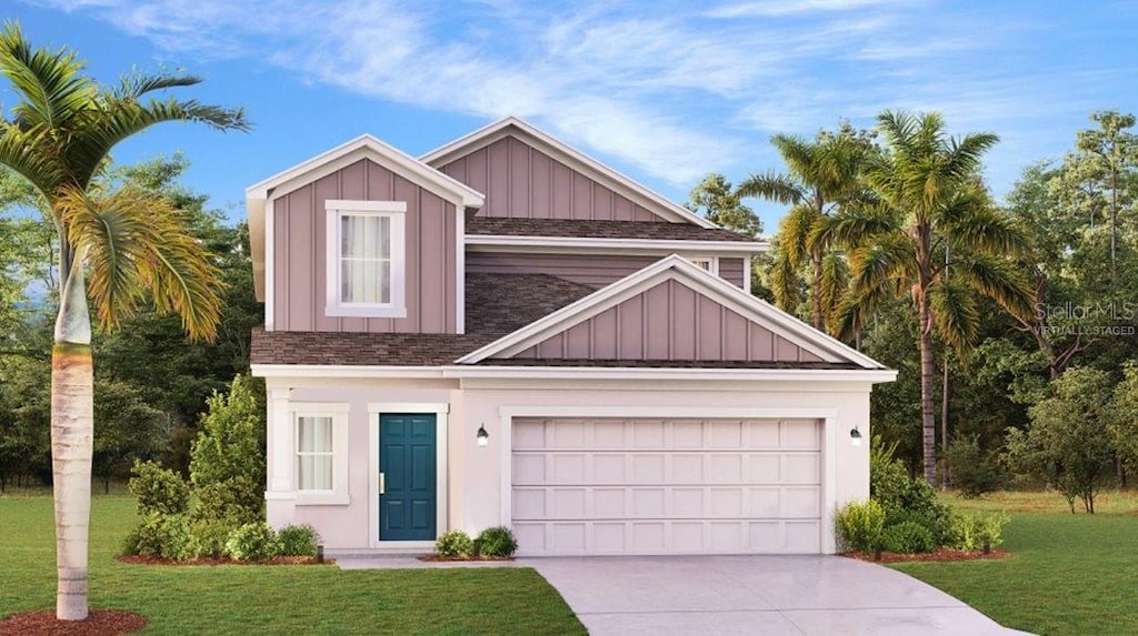 view of front of home with a garage and a front yard