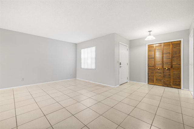 view of tiled spare room