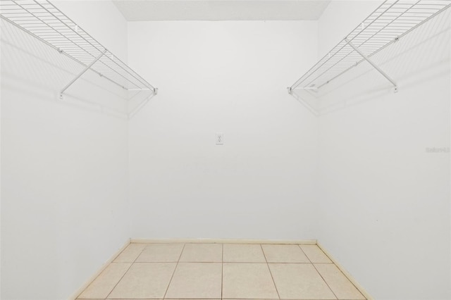 walk in closet featuring light tile patterned floors