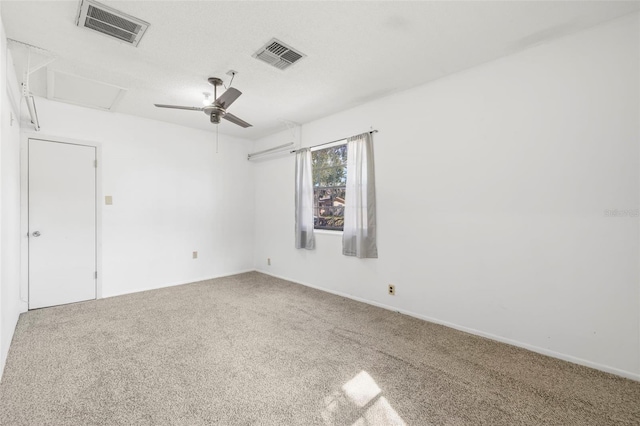 spare room with carpet floors and ceiling fan