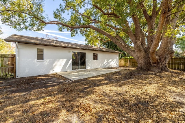 rear view of property featuring a patio