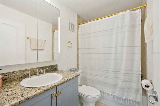 bathroom featuring vanity, toilet, and a shower with shower curtain