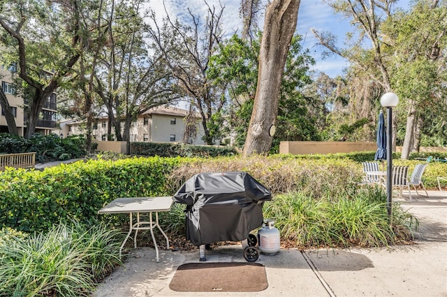 view of patio with fence and area for grilling