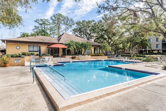 pool with a patio area