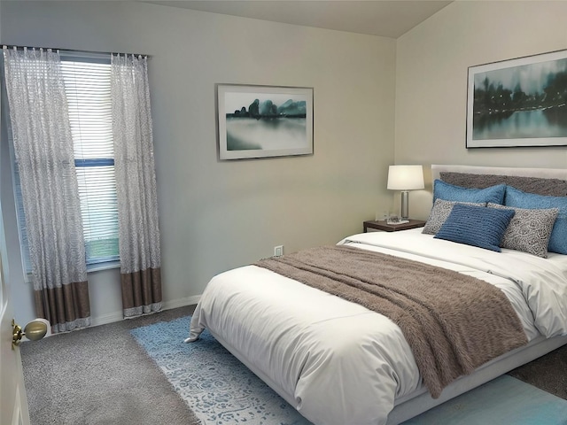 bedroom featuring multiple windows and carpet flooring