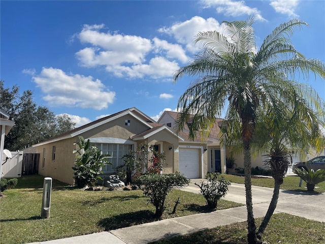 view of front of home with a garage and a front lawn