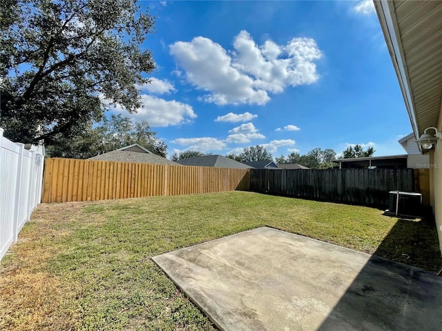 view of yard with a patio and central AC